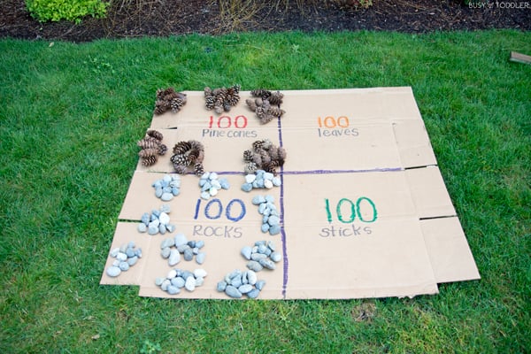 Kids learning about 100 with an outdoor math activity