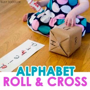 ALPHABET ROLL AND CROSS: Check out this fun DIY alphabet game that's perfect for toddlers learning their ABCs. This easy literacy activity is perfect for toddlers and preschoolers. A great indoor activity and fun game for toddlers!