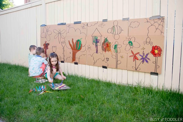 Kids having fun at a giant activity painting outside