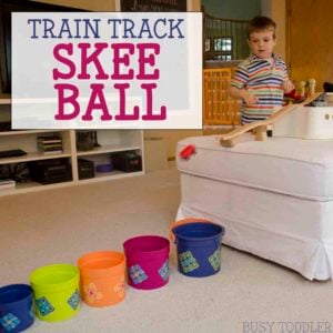 TRAIN TRACK SKEE BALL: We loved the book Old Tracks, New Tricks and it inspired this wooden train track activity. Making a fun indoor activity that toddlers and preschoolers will love. This STEM activity was so much fun!