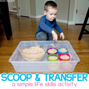 Toddler Scooping Activity: This is one of the best kinds of activities for toddlers learning to scoop and transfer. An easy sensory activity with Montessori roots. An easy indoor activity for a rainy day from Busy Toddler