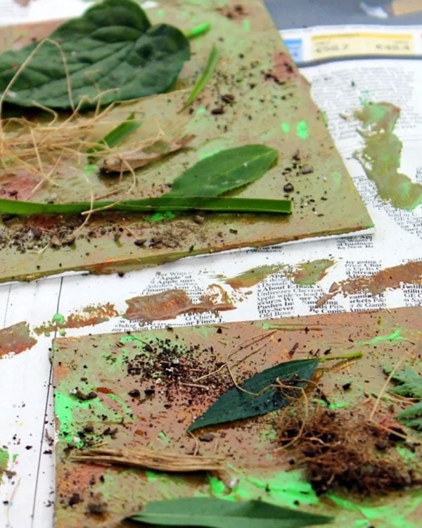 Leaves and green paint on canvas to "camouflage" the art.